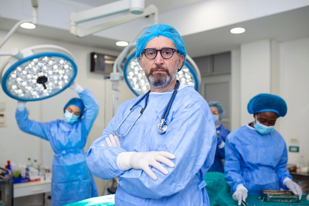 Experienced surgeon with the surgical team in an operating room